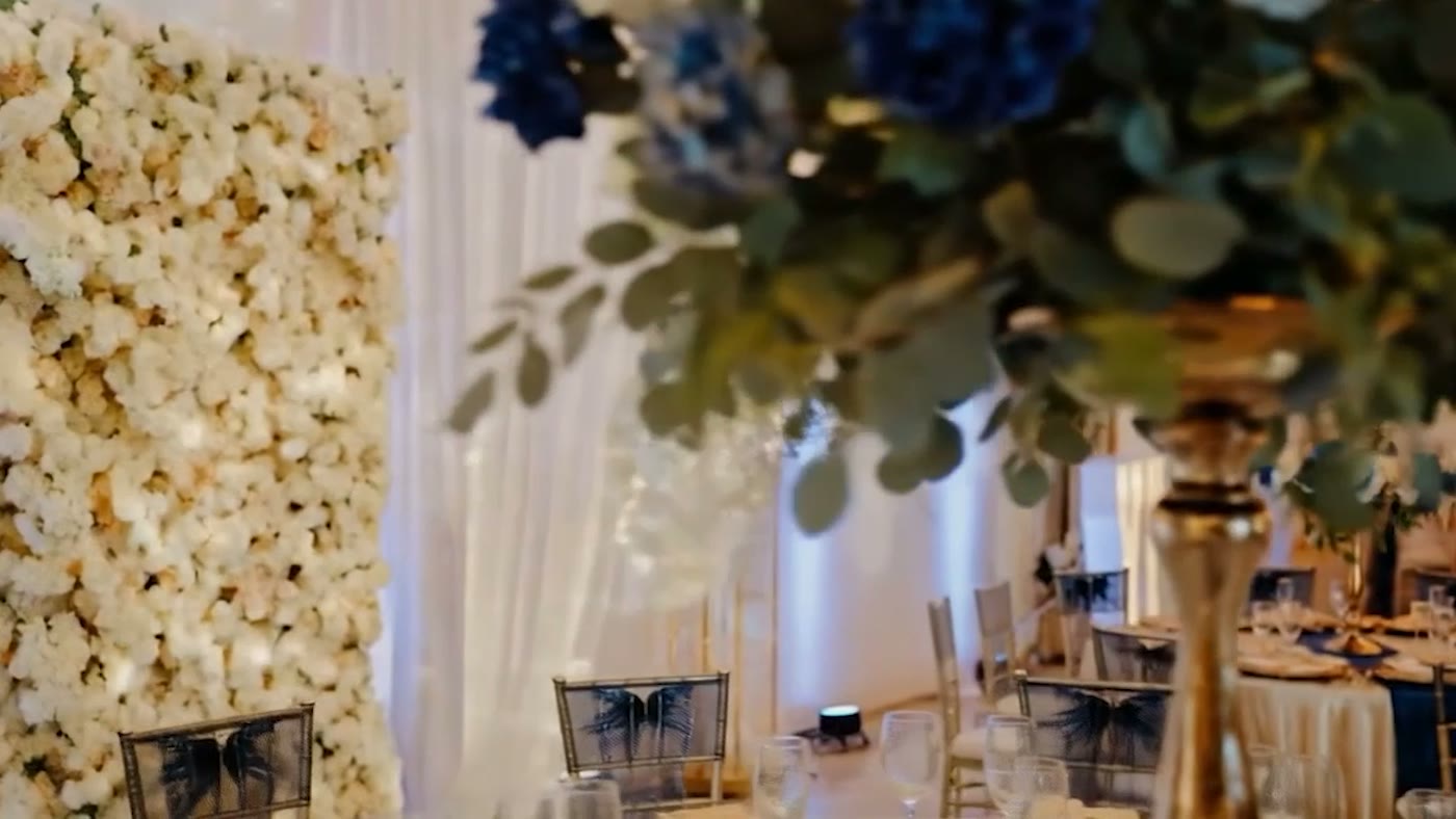 Floral wall and centerpiece detail at Nencini Ballroom
