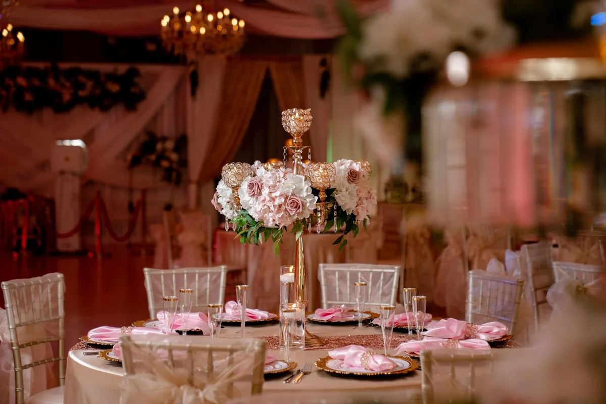 Pink and gold table styling inside Nencini Ballroom