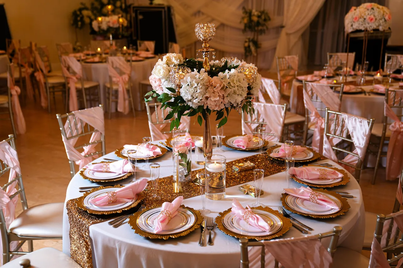 Blush flowers and gold table settings at a real Sweet 16 at Nencini Ballroom