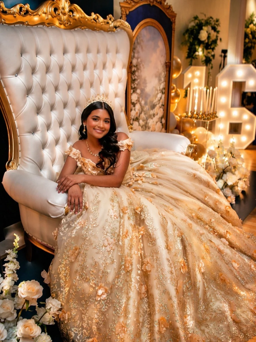 Quinceañera in a gold dress seated on an ornate gold and ivory throne